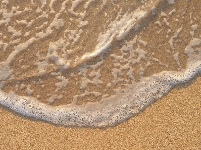 Ocean lapping on sand
