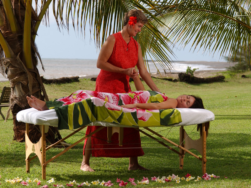 Carol Hart doing a beach massage on Kauai